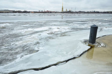 Spring came, it got warmer, and the ice on the river began to melt.の写真素材