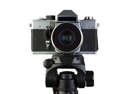 Camera on a tripod on a white background isolation