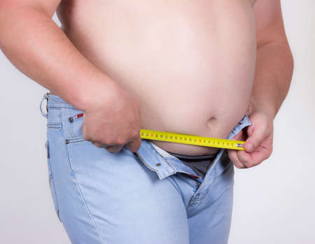 Measuring the distance to the fastener roulette, a man measures the distanceの写真素材