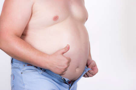 fat man indicates that all at it wellの写真素材