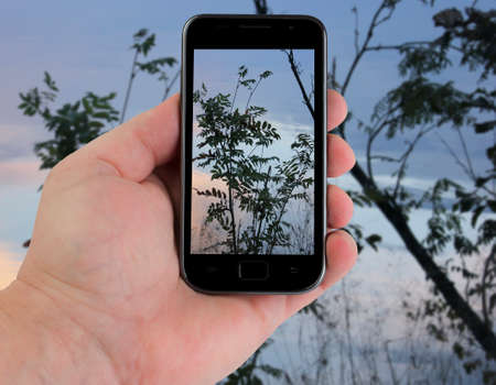 black telephone with hand isolated on white backgroundの写真素材