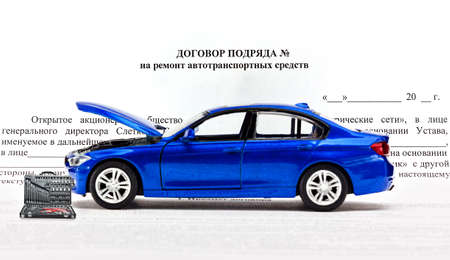 Contract for repairs of the car with a set of of keys for repair.の写真素材