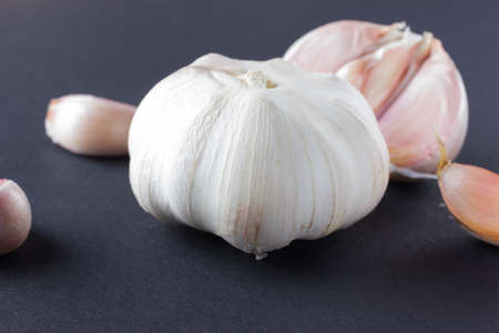 Garlic with slices on a blue background.の写真素材