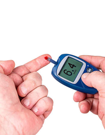 Drop of blood glucose, with monitor isolated on white background.