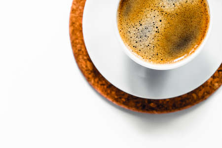 White espresso Cup on bamboo stand on isolated white background.の写真素材