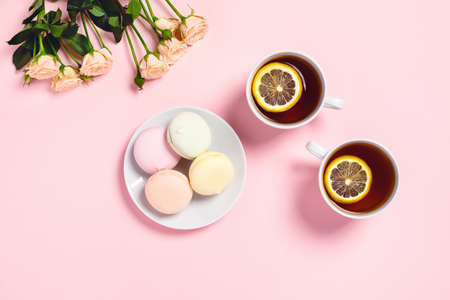Tea brake set - two cups of tea with lemon and roses with marshmallows.の写真素材