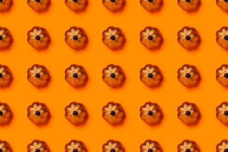 Halloween concept. White skeletons chaotically arranged on orange table. Flat-lay, top view, copy space.の写真素材