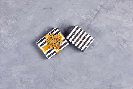Christmas concrete background with two present gifts. Flat lay, top view, copy space.の写真素材
