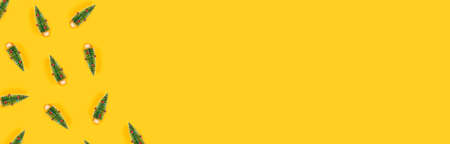 Christmas and New year yellow decorative banner with christmas trees. Flat lay, top view, copy...