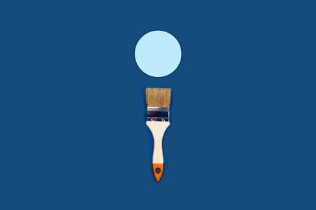 Renovation concept. Classic blue background with paint brush and blue circle. Flat lay, top view, copy space.の写真素材