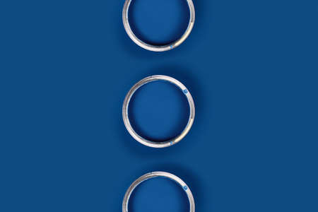 Repair picture. Classic blue background with three blue paint cans. Flat lay, top view, copy space.の写真素材