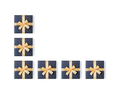 Holiday card. Grey gift boxes with gold bow on isolated white background. Flat lay, top view, copy...