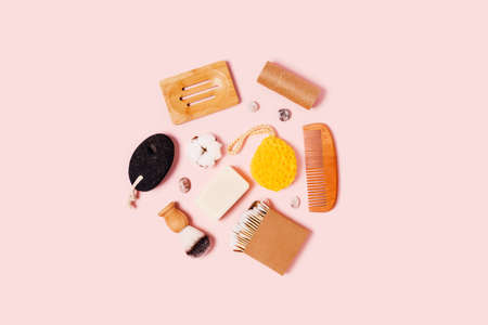 Eco-friendly accessories for women's bathroom: pumice, natural sponge, cotton swab, wooden comb,...