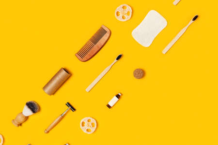 Ecological accessories for body care: natural sponges, wooden comb, shaving brush, glass bottle with...