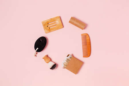 Eco-friendly accessories for women's bathroom: pumice, cotton swab, wooden comb, wooden stand, shaving brush. Flat lay, top view, copy space.の写真素材