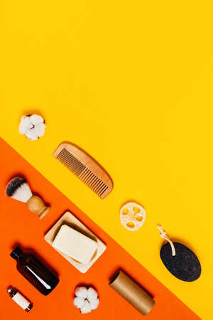 Ecological accessories for body care on two-toned yellow and orange background.の写真素材