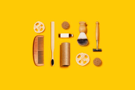 Ecological accessories for male body care on yellow background.