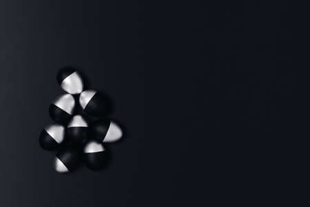 Five black and silver Easter eggs on dark grey background. Flat lay, top view, copy space.の写真素材
