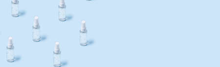 Pattern with bottles of hand sanitizer with antimicrobial transparent gel with bubbles for...