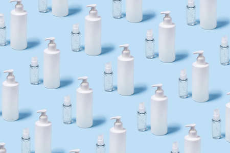 Front view with a bottles of antiseptic soap and a hand sanitizer.の写真素材