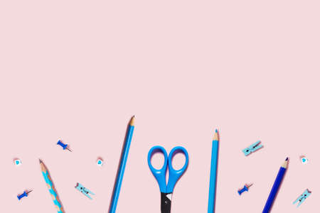 Back to school flat lay with blue pencils, paper clips and scissors.の写真素材