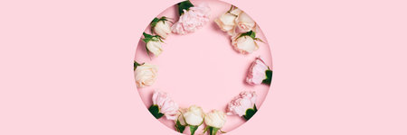 Festive greeting web banner with a bouquet of roses lying on a carved background of pink paper.の写真素材