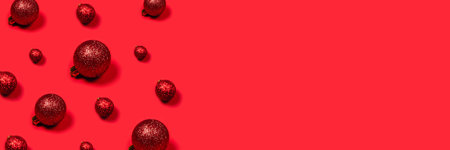Christmas festive banner with red festive balls and place for text.