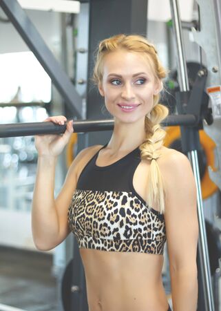 beautiful woman is training in the sports hall. sport life.の写真素材
