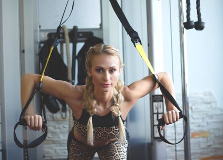 beautiful woman is training in the sports hall. sport life.の写真素材