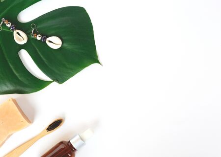The concept of zero waste. bamboo toothbrush, solid shampoo and manstera branch.の写真素材