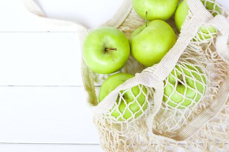 Package-free food shopping. Eco friendly natural bag with organic apples. Zero waste concept.の写真素材