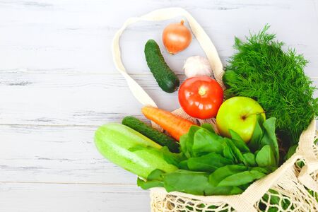 Package-free food shopping. Eco friendly natural bag with organic fruits and vegetables. Zero waste concept.の写真素材