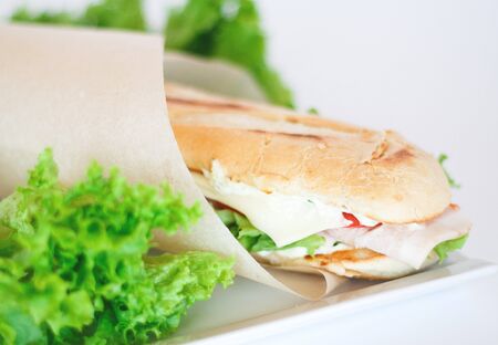 delicious fresh crisp baguette sandwich with herbs.の写真素材