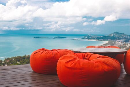 comfortable ottomans on top of a mountain with ocean views.の写真素材