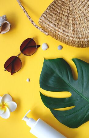 Flat lay traveler accessories on yellow background. Top view travel and vacation concept. Summer background.の写真素材