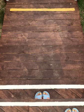 legs stand on lines to maintain social distance.の写真素材