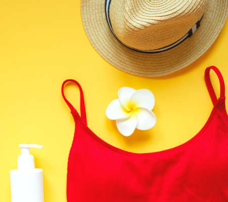 set of summer beach accessories on a yellow background.の写真素材