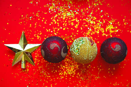 Christmas balls and star on a red background.の写真素材