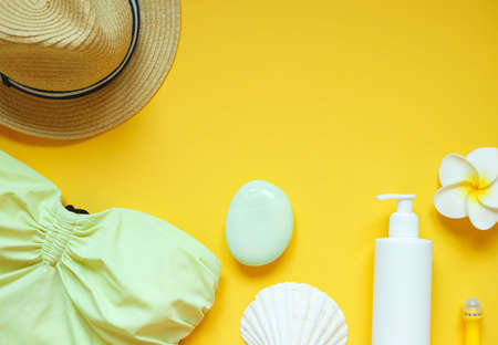 set of summer beach accessories on a yellow background.の写真素材