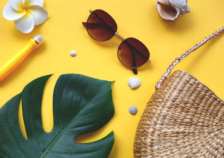Flat lay traveler accessories on yellow background. Top view travel and vacation concept. Summer background.の写真素材