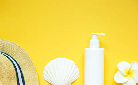 set of summer beach accessories on a yellow background.の写真素材
