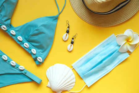 set of summer beach accessories on a yellow background.の写真素材