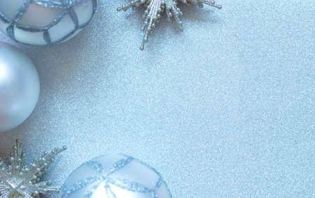 silver stars and balls christmas toys on silver background.の写真素材