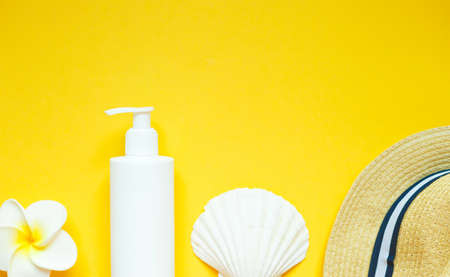 set of summer beach accessories on a yellow background.の写真素材