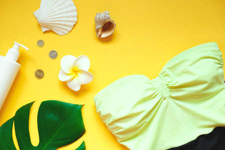Flat lay traveler accessories on yellow background. Top view travel and vacation concept. Summer background.の写真素材