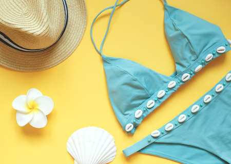 set of summer beach accessories on a yellow background.