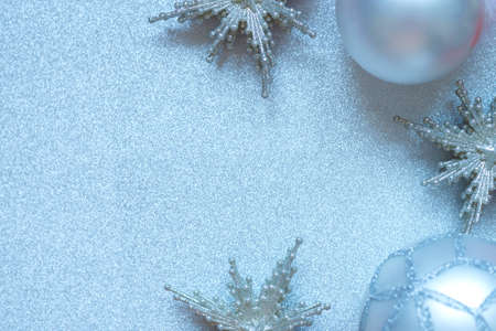 silver stars and balls christmas toys on silver background.の写真素材