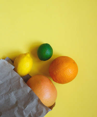juicy ripe citrus fruits in an eco-friendly shopping bag.の写真素材