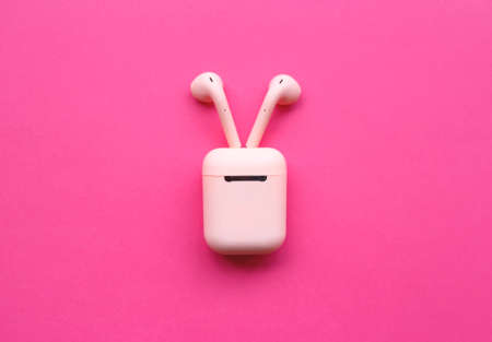 pink headphones on a pink background.の写真素材