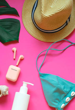set of summer beach accessories on a pink background.の写真素材